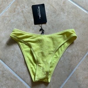 Pretty Little Thing light lime mini crinkle cheeky bum bikini bottoms